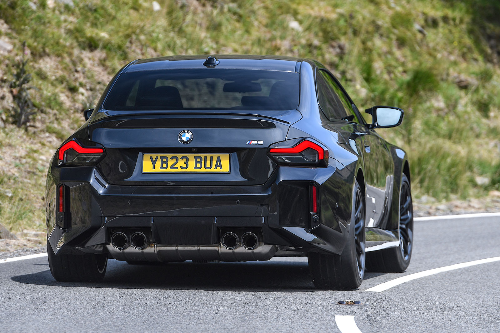 bmw m2 road test review 2023 03 cornering rear