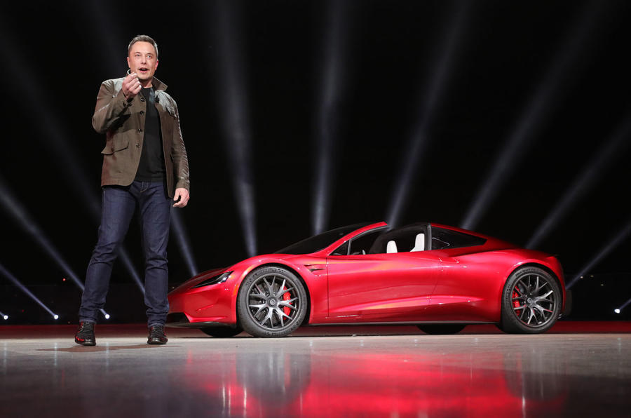 aria-label="elon musk presents tesla roadster 0"