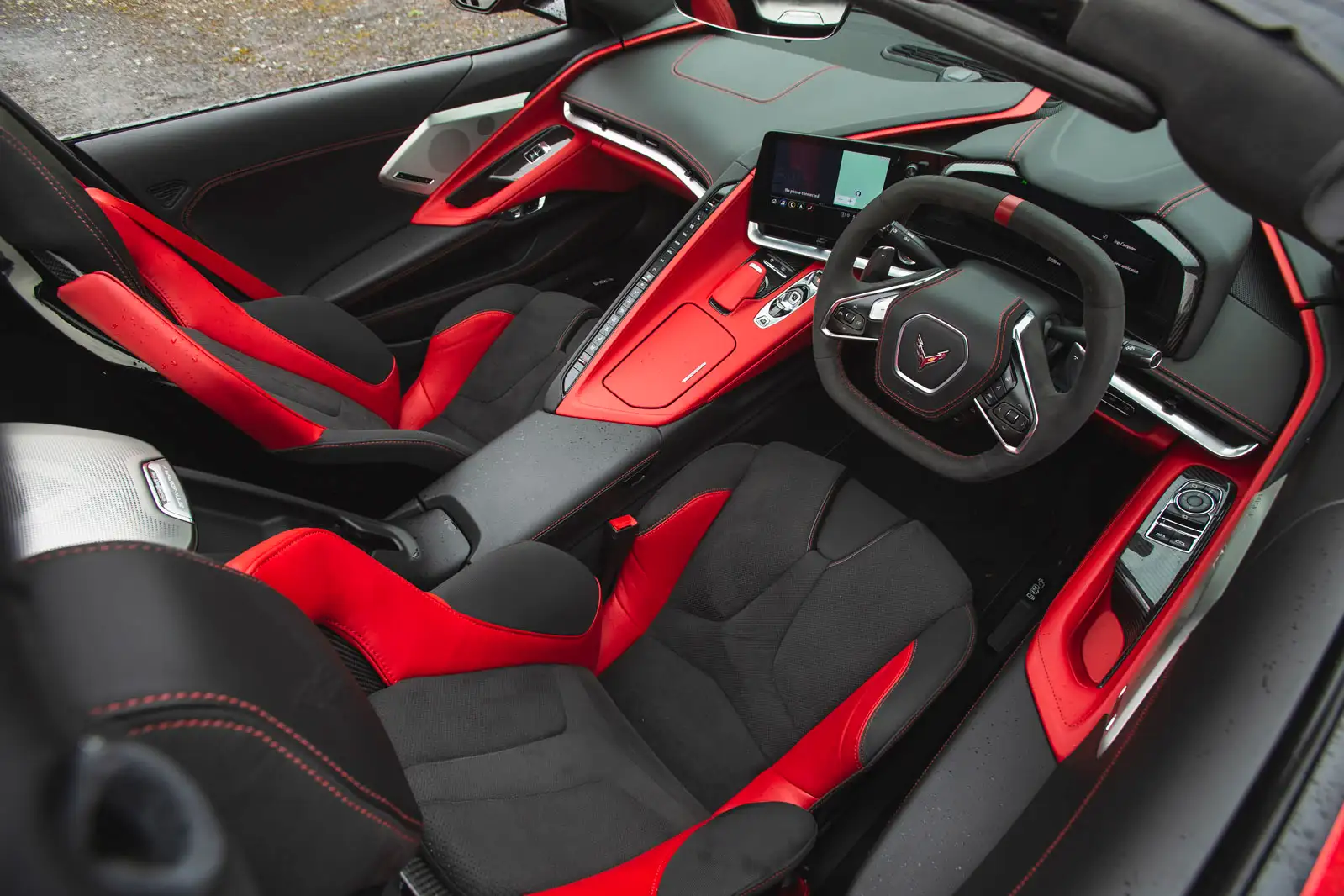 Interior view of the EU version of the C8 Corvette black and red interior.