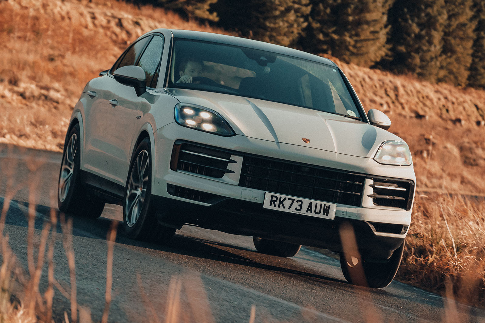 porsche cayenne e hybrid coupe review 2024 01 cornering front porsche cayenne e hybrid coupe review 2024 01 cornering front