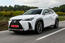 Lexus UX front three-quarter on road