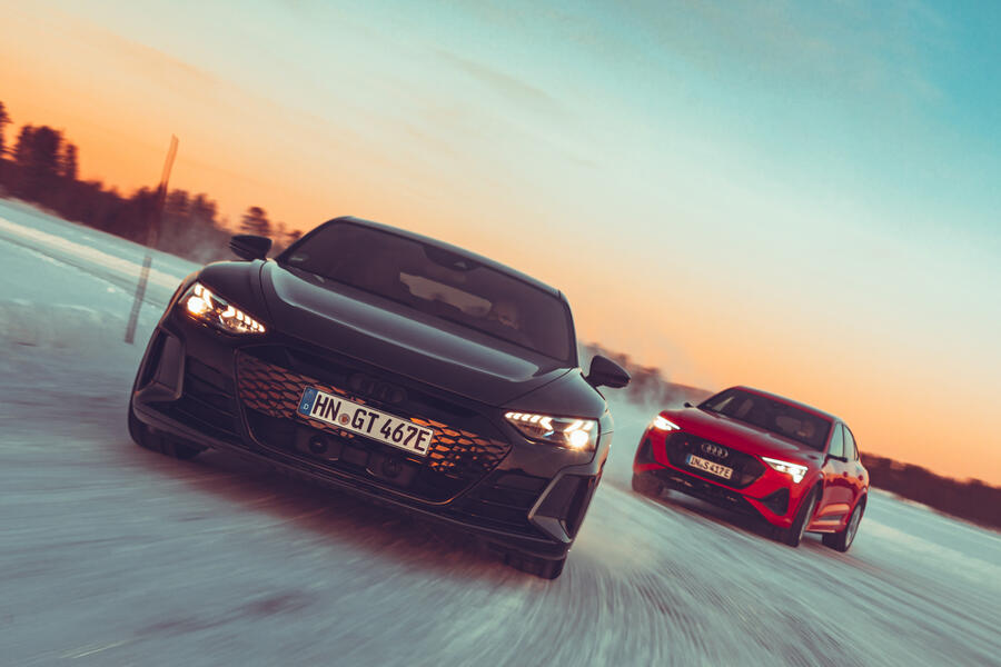 85 Audi e tron gt audi e tron sportback drifiting front sunset