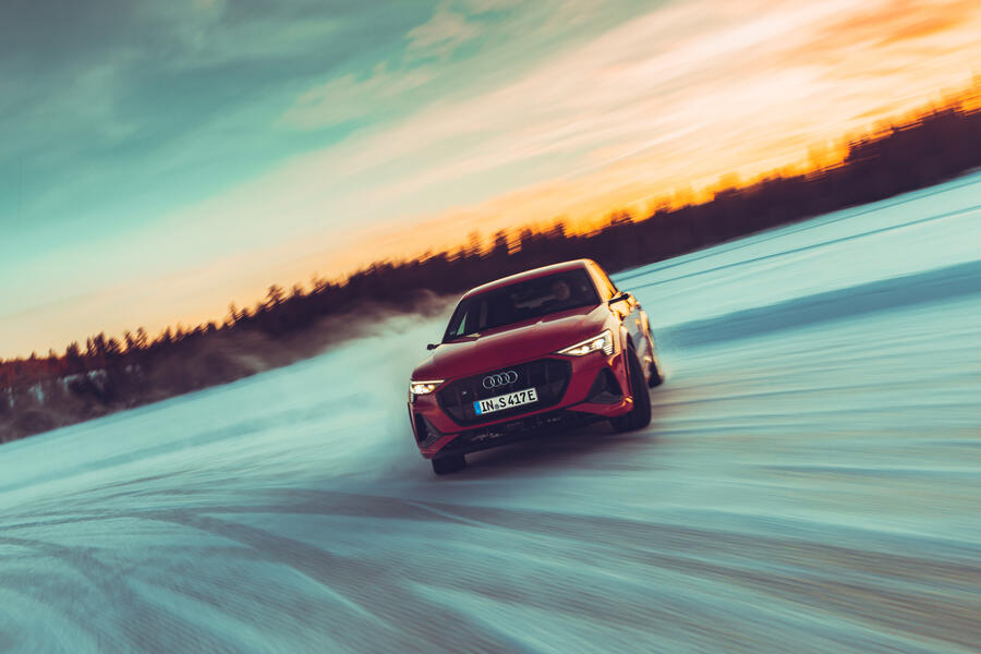 85 Audi e tron s sportback front view drifting sunset