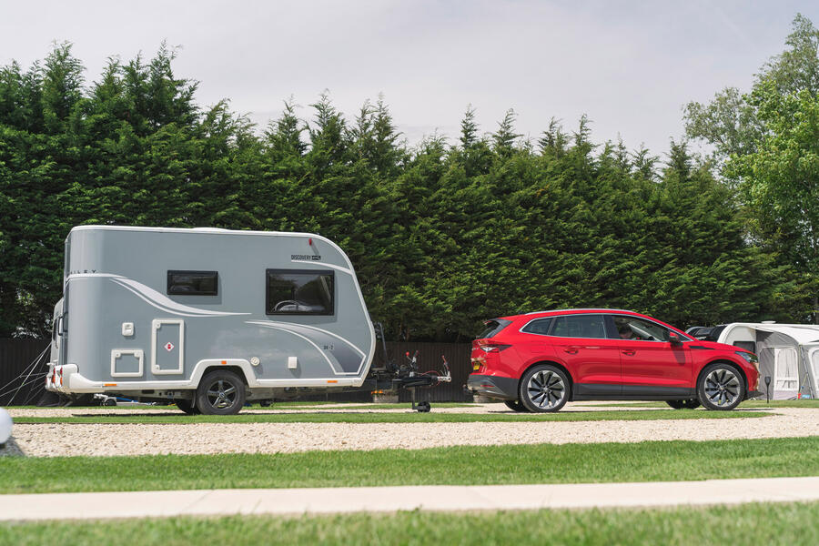 90 Skoda enyaq iv 80 towing caravan side view