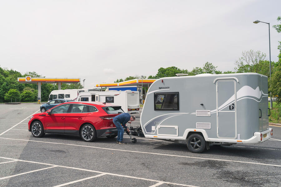 95 Skoda enyaq iv 80 towing caravan unhitch side view