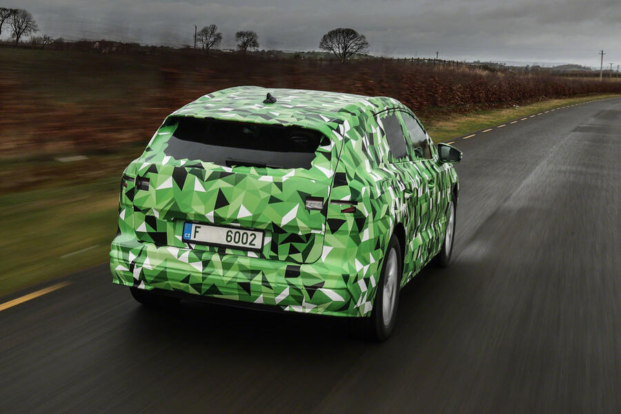 aria-label="97 skoda enyaq camo drive 2020 hero rear"