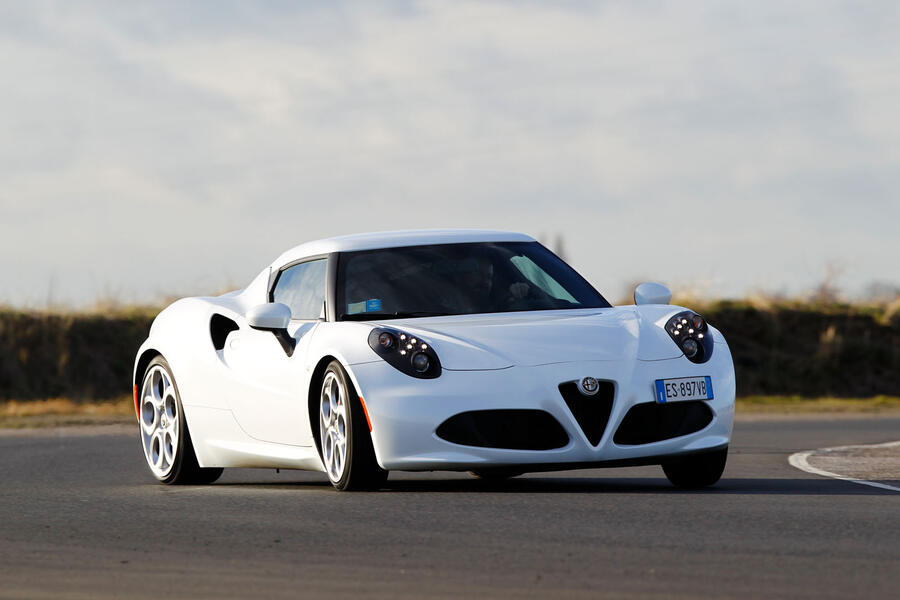 White Alfa Romeo 4C powersliding â€“ front quarter