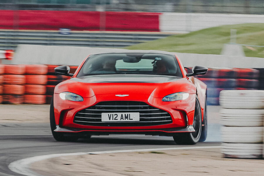 Aston Martin V12 Vantage powersliding on track â€“ front