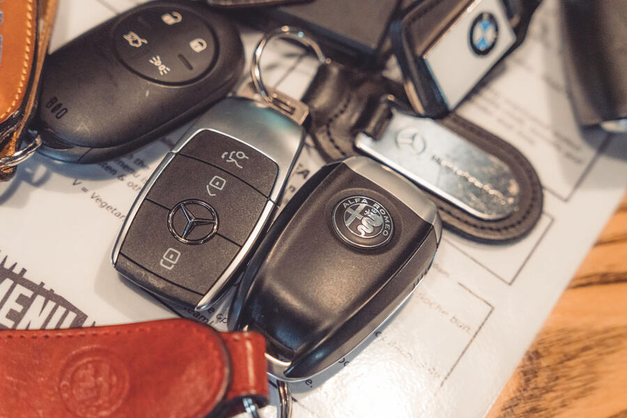 Group of car keys laid out on table