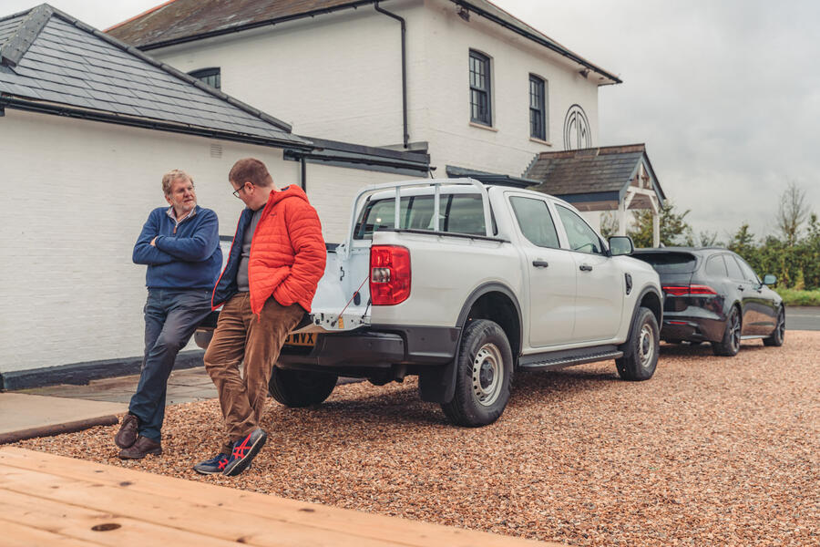 Steve Cropley and Matt Saunders talking, sat on the tailgate of a Ford Ranger