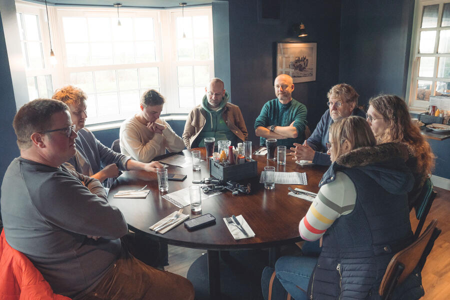 Autocar road testers gather around a round table