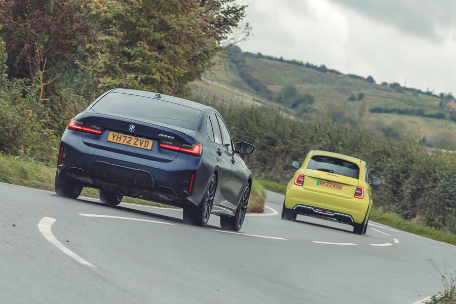 BMW M340i following Abarth 500e