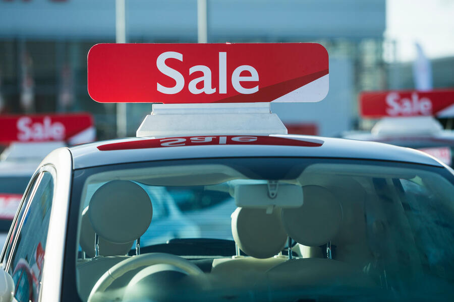 Car with sale sign