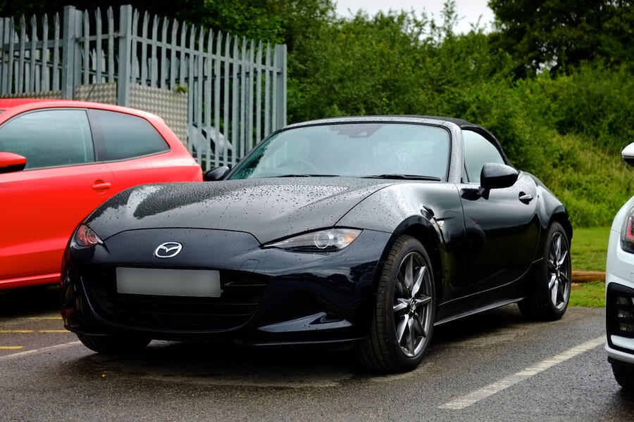 Charlie Martin's Mazda MX-5 parked in the rain