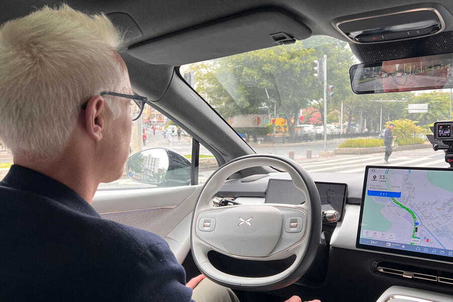 Nick Gibbs supervising Xpeng P7+ driving
