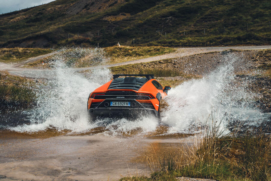 Lamborghini Huracan Sterrato driving through water â€“ rear
