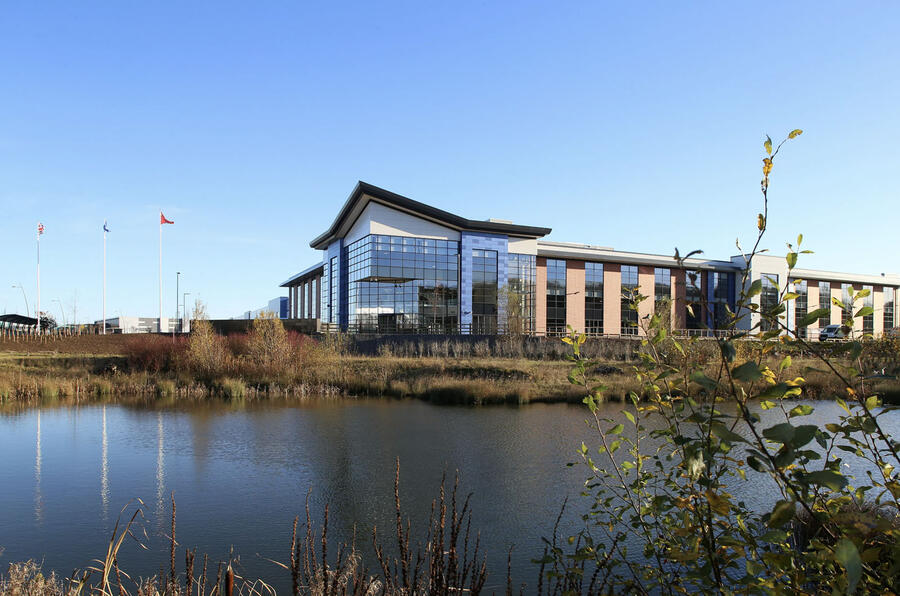 Levc ansty factory exterior with lake
