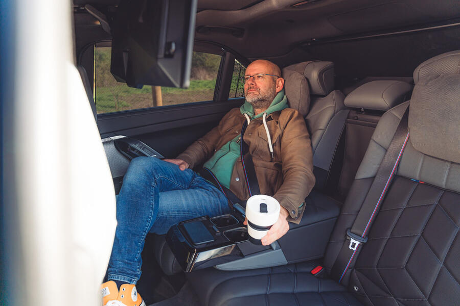 Matt Prior relaxes by watching a video in the back of the BMW i7