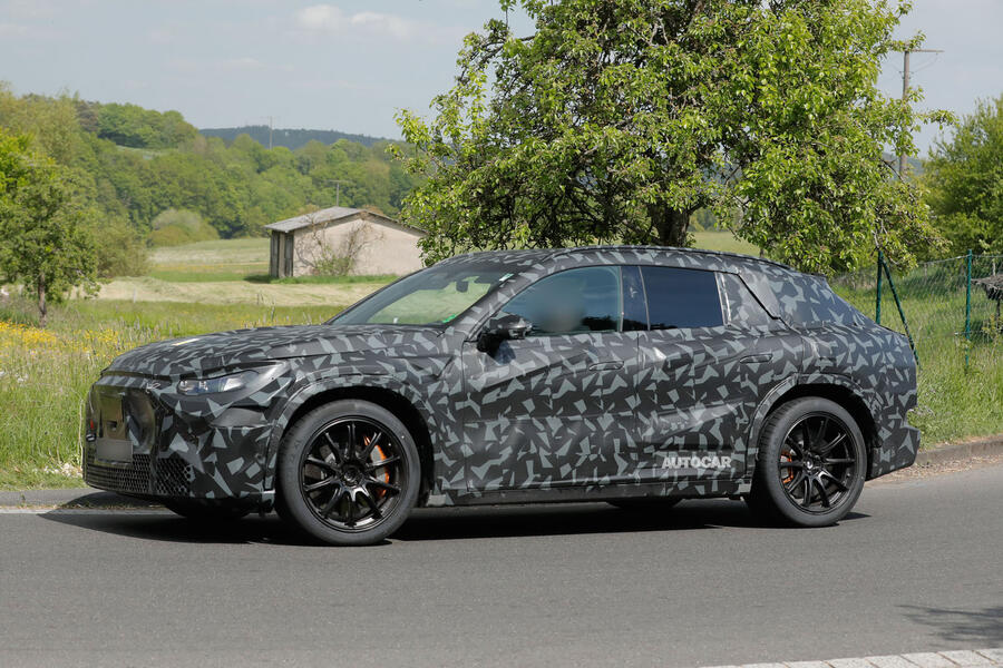 Mercedes-AMG SUV camouflaged, front quarter, turning