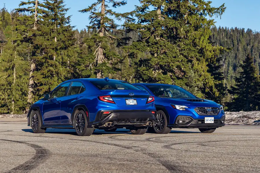 Two Subaru WRXs parked side by side