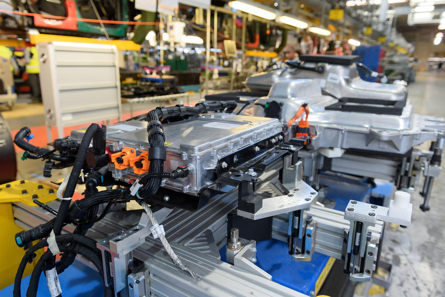 Plug-in hybrid car battery pack mounted to chassis at JLR Halewood factory