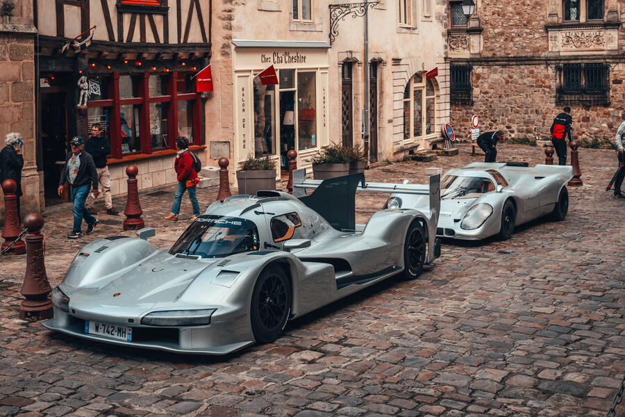 Porsche 963 RSP and 917 parked on the streets of Le Mans – front
