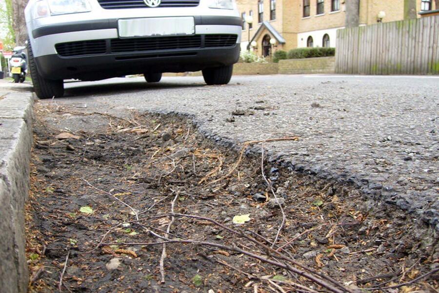 Pothole on kerbside