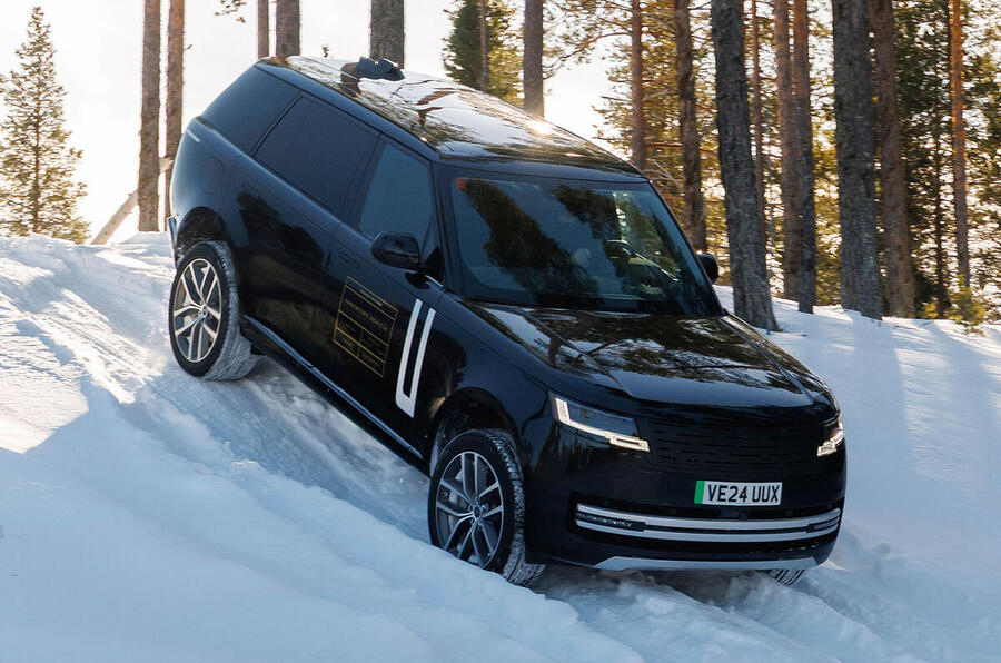 2025 Range Rover Electric in winter testing – front quarter, downhill