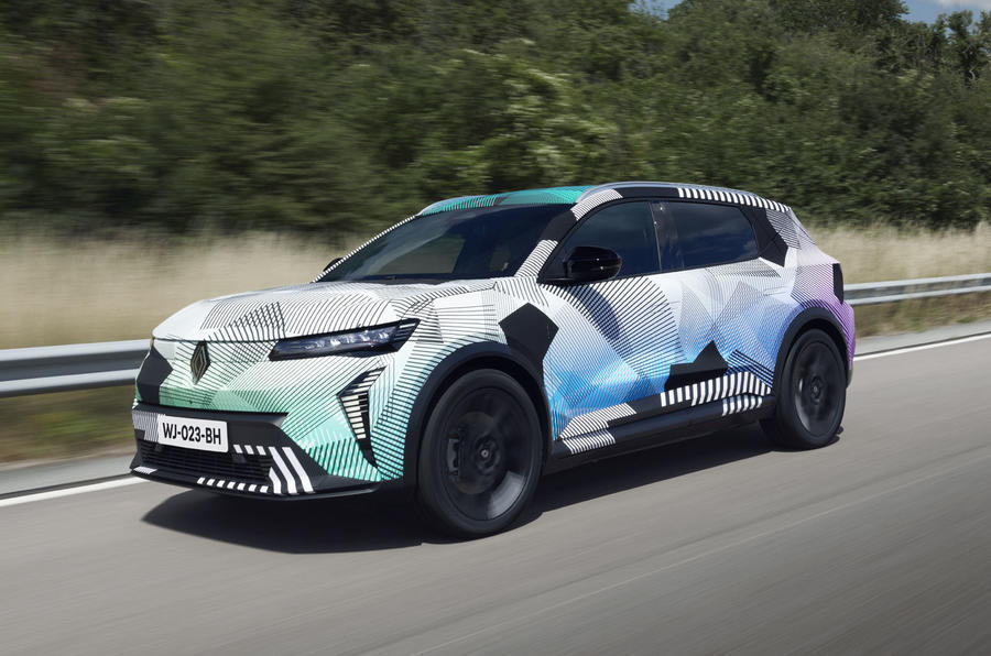 Renault Scenic 2024 front quarter driving down road with camouflaged exterior