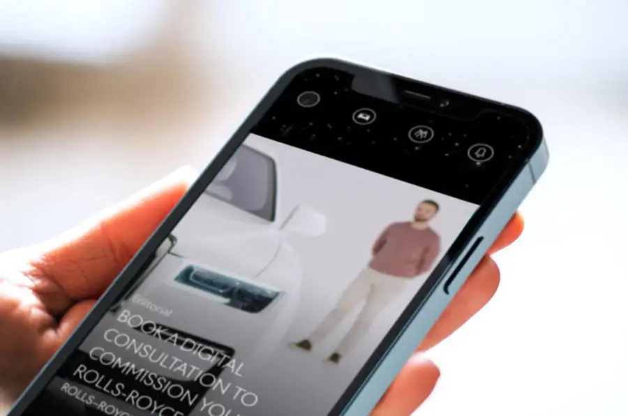 Rolls royce whispers app in hand