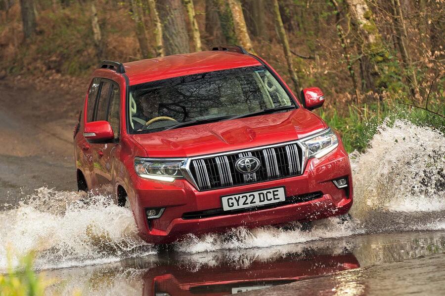 Toyota Land Cruiser driving done  large  puddle