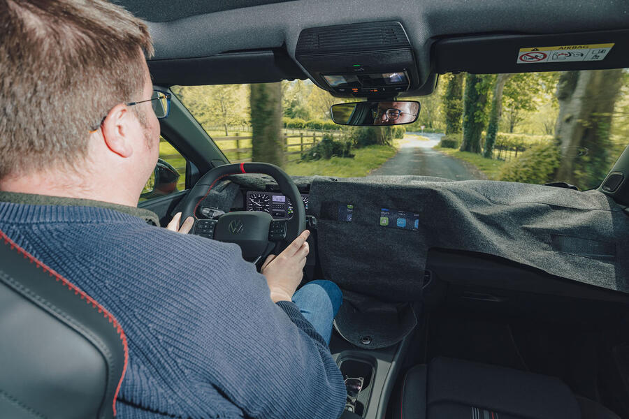 Matt Saunders driving VW ID Polo GTI prototype, with interior covered