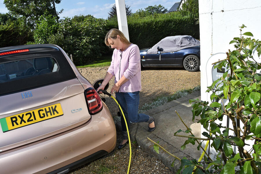 Claire Evans charging a Fiat 500e