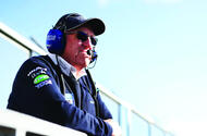 BTCC Peter Riches BTCC Peter Riches standing wearing headset