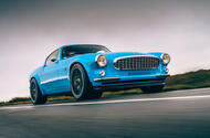 Cyan Volvo P1800 drive - hero front
