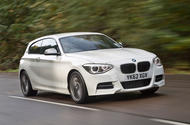 BMW M135i 2012 front quarter tracking hero