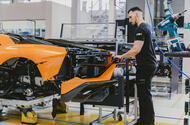 McLaren factory worker installing bumper McLaren factory worker installing bumper