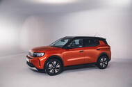 Orange Vauxhall Frontera in a studio   front three quarters