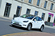 Tesla Model Y cornering through town