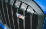 07 BMW X7 M60i RT 2023 M badge on black grille