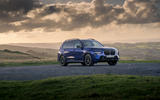 24 BMW X7 M60i RT 2023 static front moody skies