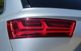 The Audi Q7's rear lights include the visual drama of the indicators sweeping left to right