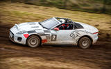 Jaguar F-Type rally car 2019 driven gravel side