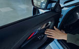 Bold BMW M colours in the door panel enhance the BMW M2's race-inspired character