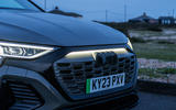 The Audi Q8 e-tron's exterior ambient lighting with grille illumination in action