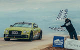 bentley continental gt driven by rhys millen crosses the line at pikes peak breaking the production car record