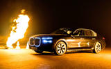 BMW i7 Protection driving past fire