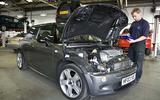 Dealer working on car Mini Cooper