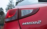 The Mazda 2's rear light cluster is similar to the 3, but not the same due to space constraints