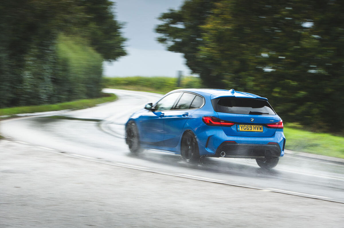 BMW 1 Series 118i 2019 road test review - on the road rear
